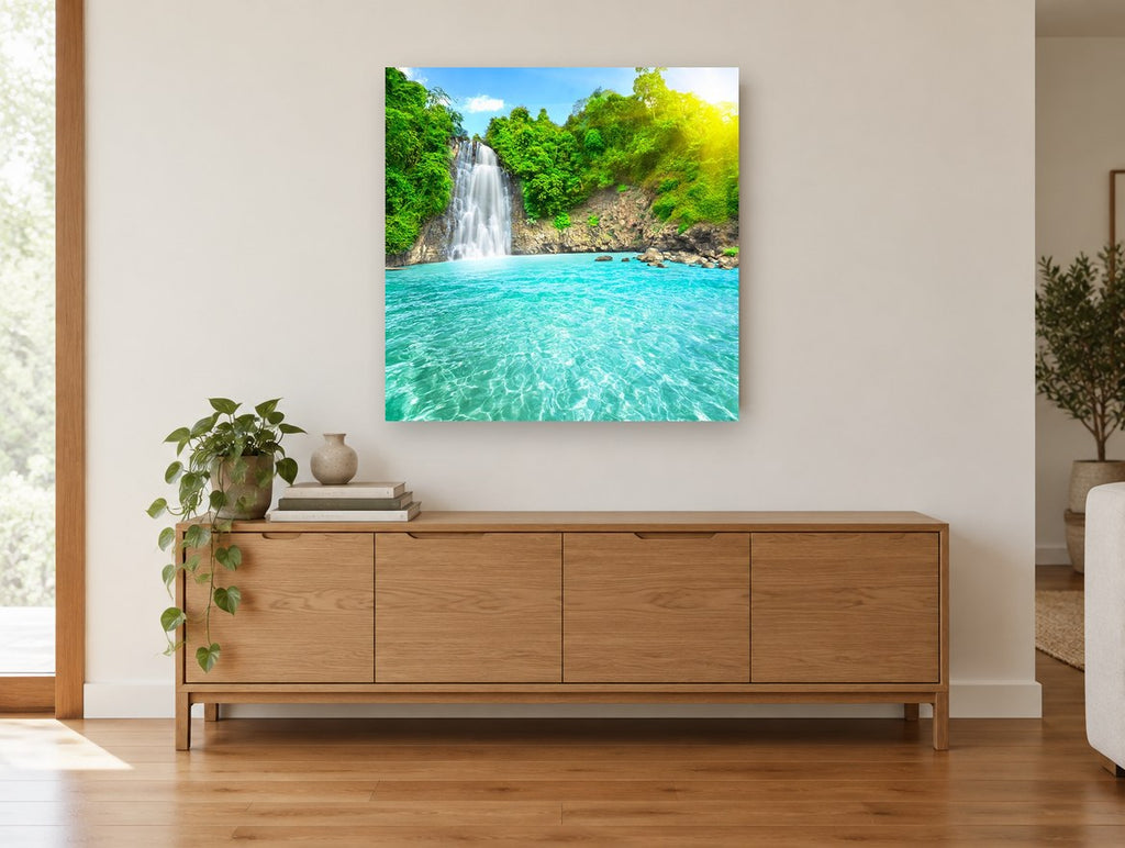Turquoise Falls Lagoon landscape canvas print on the wall of a living room above a sideboard