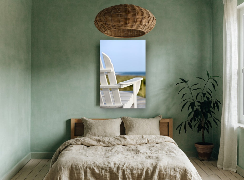 White Chair Ocean Lookout coastal canvas print on the wall of a bedroom