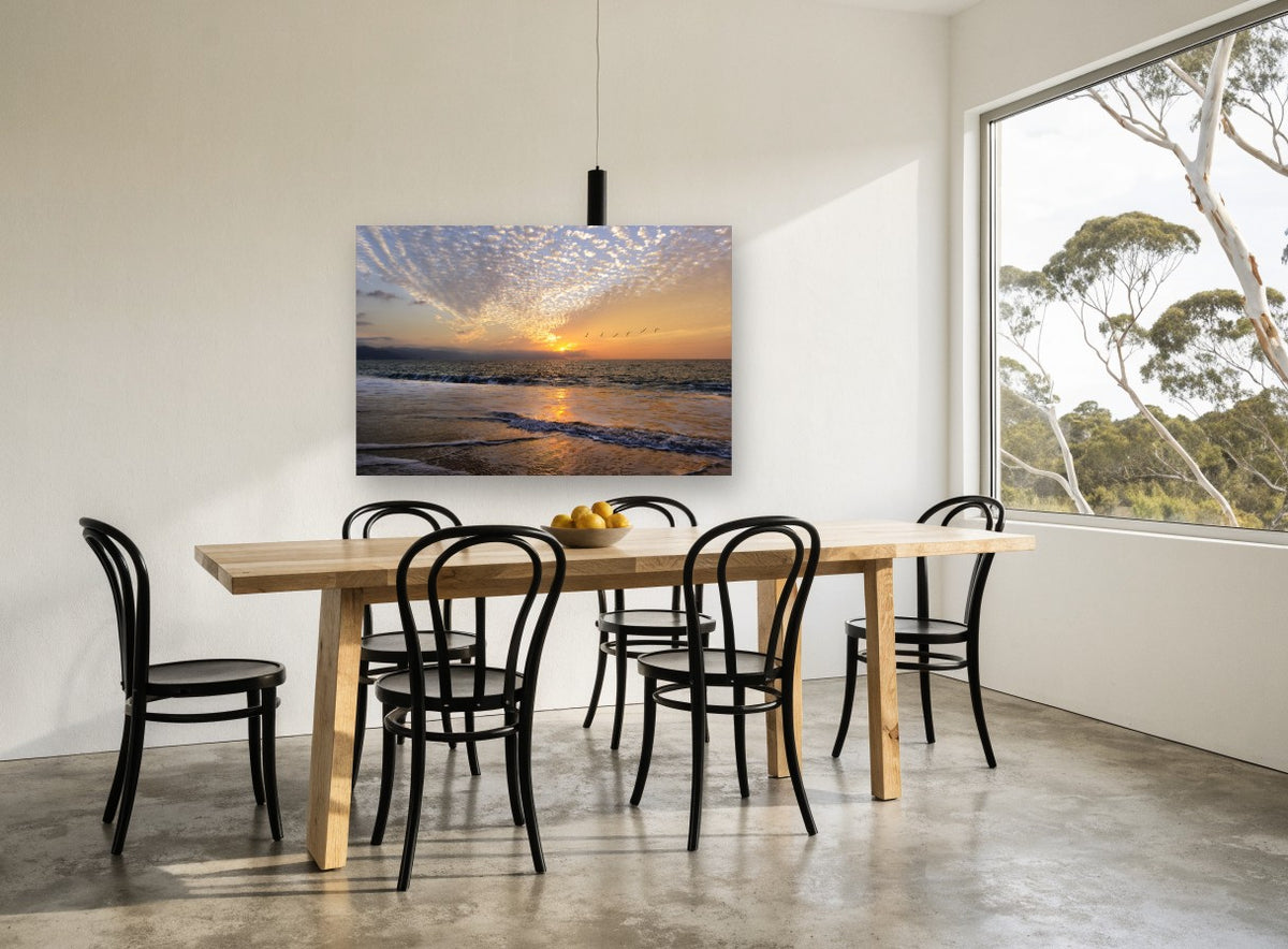 Pelicans at Sunset Shore coastal canvas print on the wall of a dining room