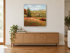 Poppy Hillside Cypresses floral canvas print on the wall of a living room above a sideboard