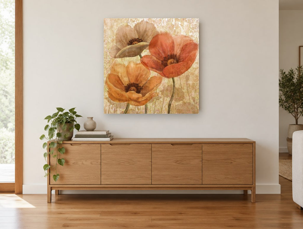 Three Poppies in Amber floral canvas print on the wall of a living room above a sideboard