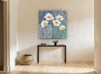 White Poppies on Blue floral canvas print on the wall of a hallway