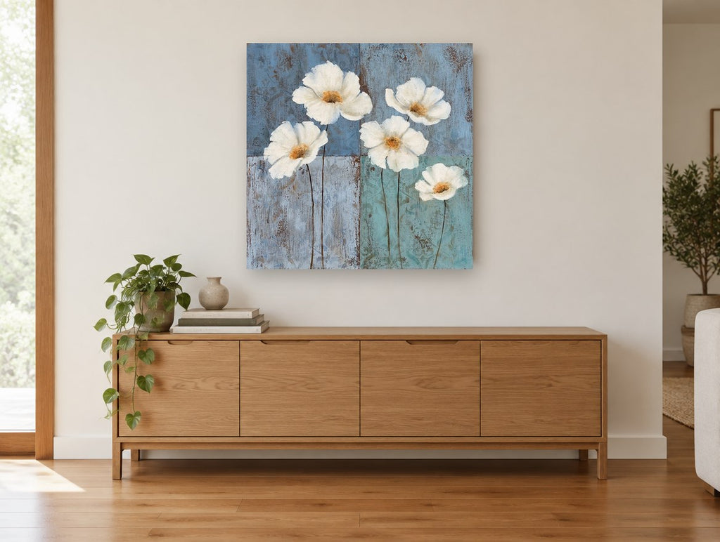 White Poppies on Blue floral canvas print on the wall of a living room above a sideboard