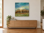 Amber Grove Clearing landscape canvas print on the wall of a living room above a sideboard