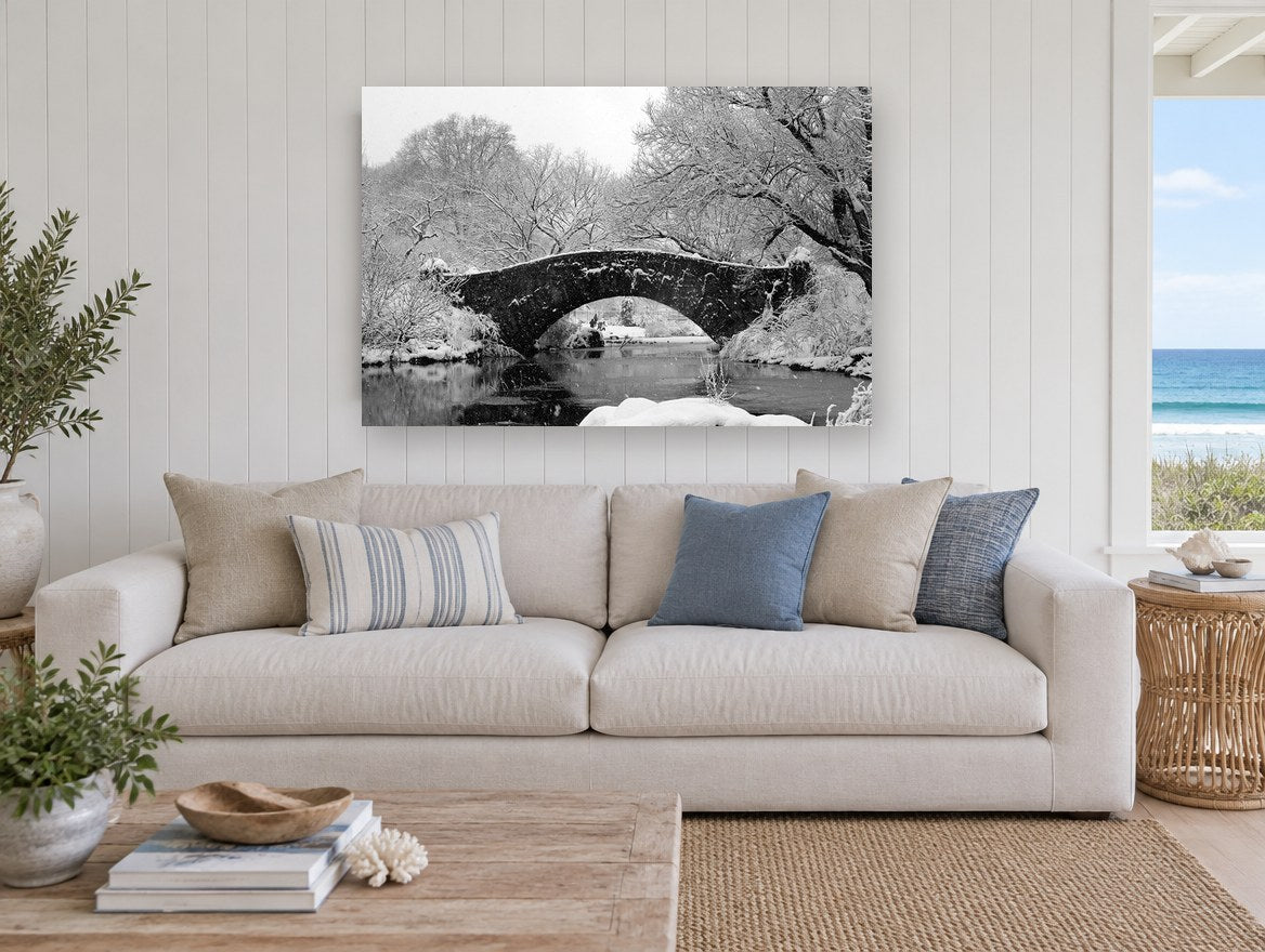 Snowbound Stone Arch city canvas print on the wall of a beach house living room
