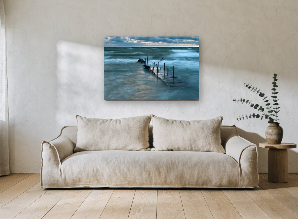 Storm Light Jetty coastal canvas print on the wall of a living room