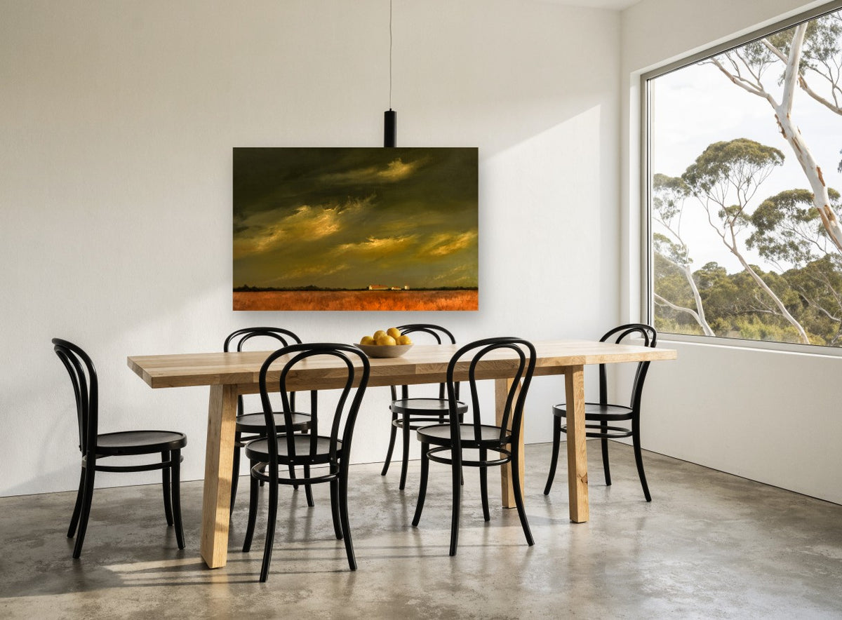 Farm Under Storm Light landscape canvas print on the wall of a dining room