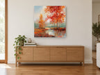 Crimson Birch Pool landscape canvas print on the wall of a living room above a sideboard