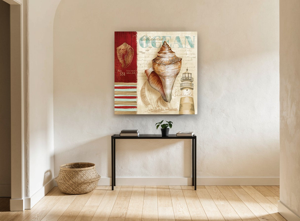 Shell and Lighthouse Collage coastal canvas print on the wall of a hallway