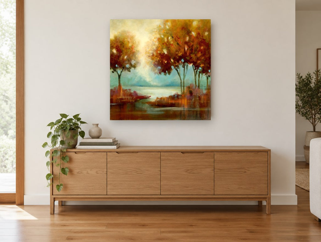 Amber Light Over Water landscape canvas print on the wall of a living room above a sideboard