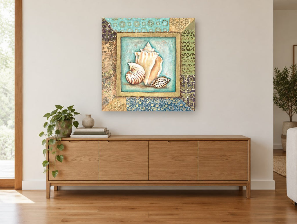Shell Trio Patchwork coastal canvas print on the wall of a living room above a sideboard