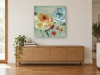 Blue Rose French Label floral canvas print on the wall of a living room above a sideboard
