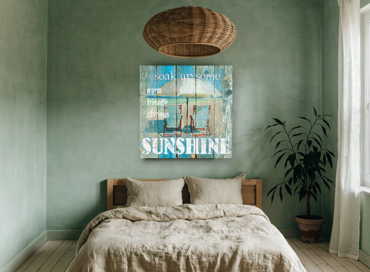 Sunshine Beach Chairs coastal canvas print on the wall of a bedroom