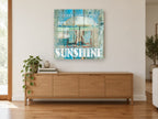 Sunshine Beach Chairs coastal canvas print on the wall of a living room above a sideboard