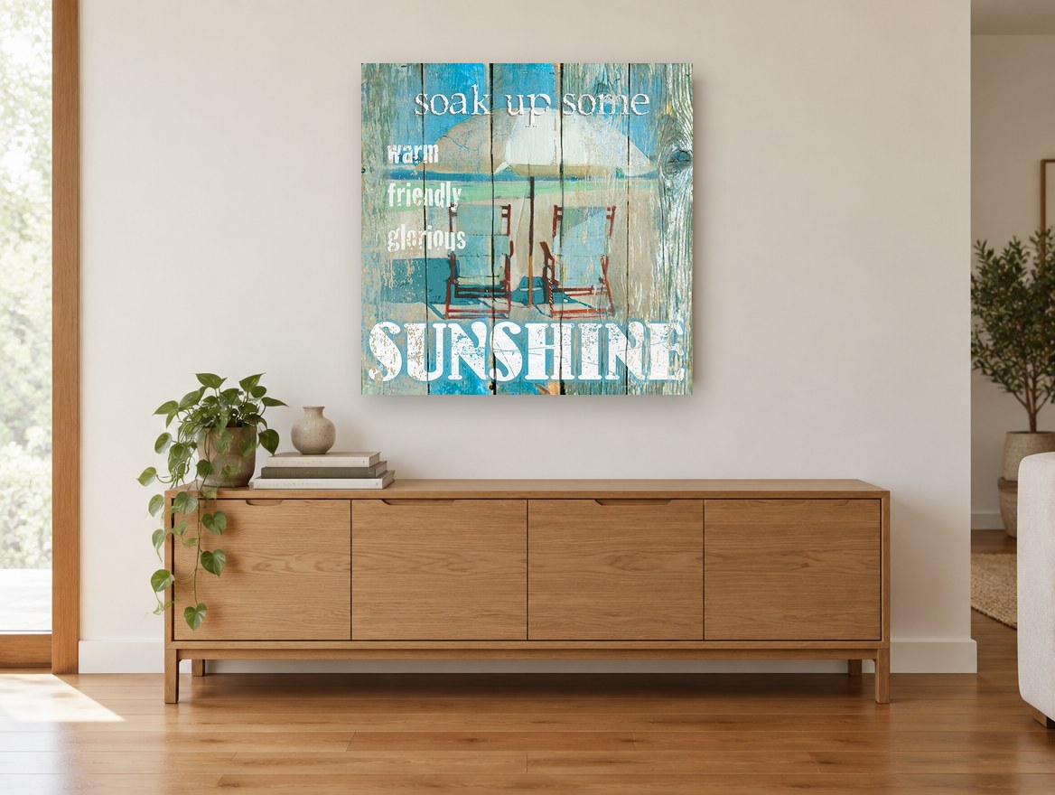 Sunshine Beach Chairs coastal canvas print on the wall of a living room above a sideboard