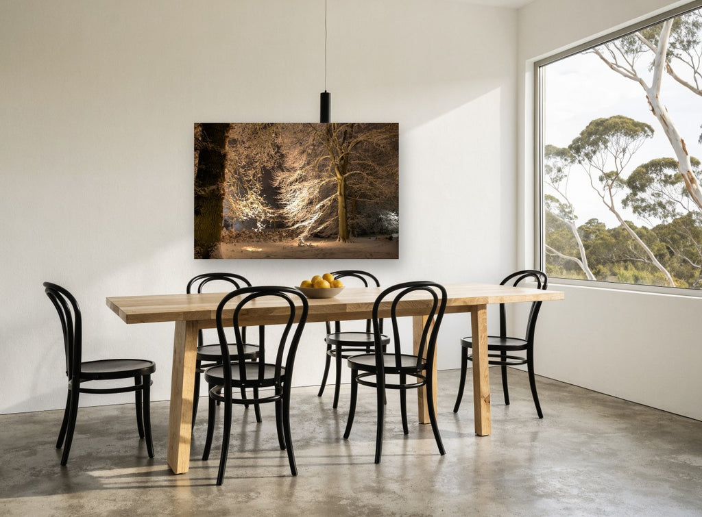 Lantern-Lit Snowy Beeches landscape canvas print on the wall of a dining room