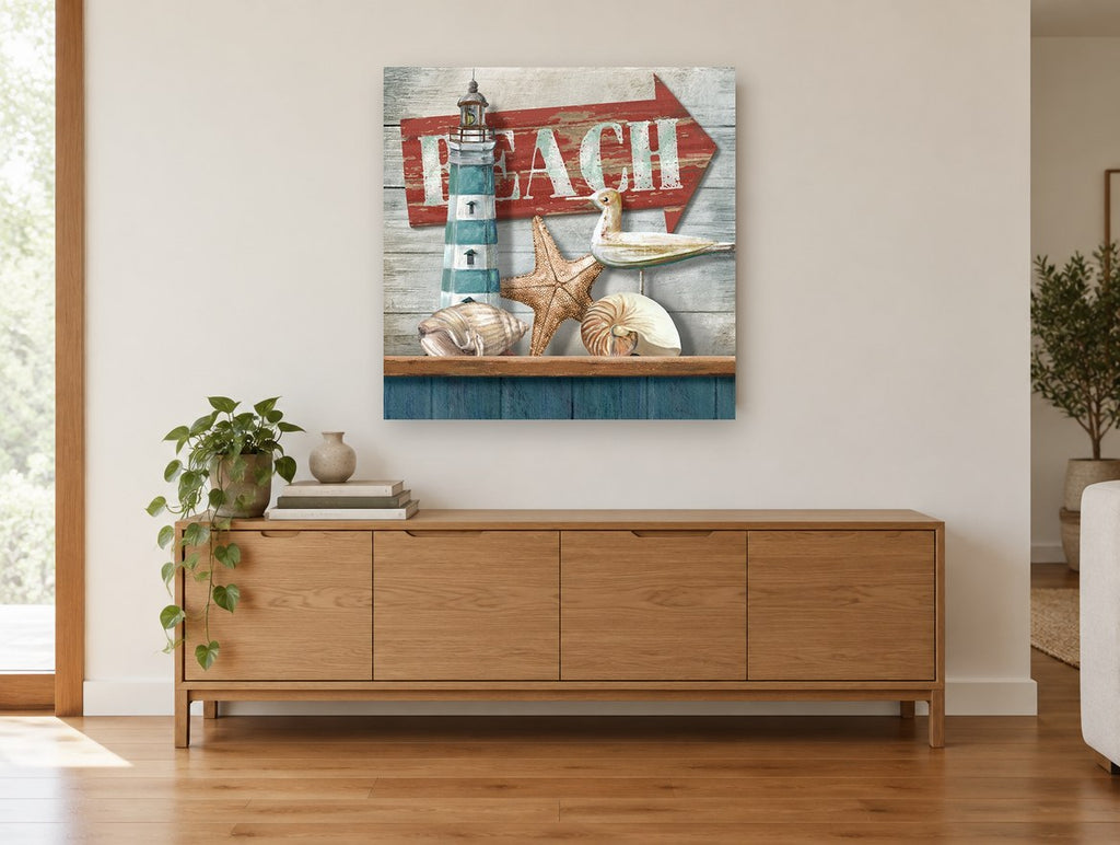 Beach Shelf Still Life coastal canvas print on the wall of a living room above a sideboard