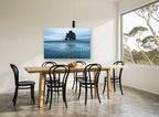 Arch at Low Tide coastal canvas print on the wall of a dining room