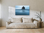 Arch at Low Tide coastal canvas print on the wall of a living room
