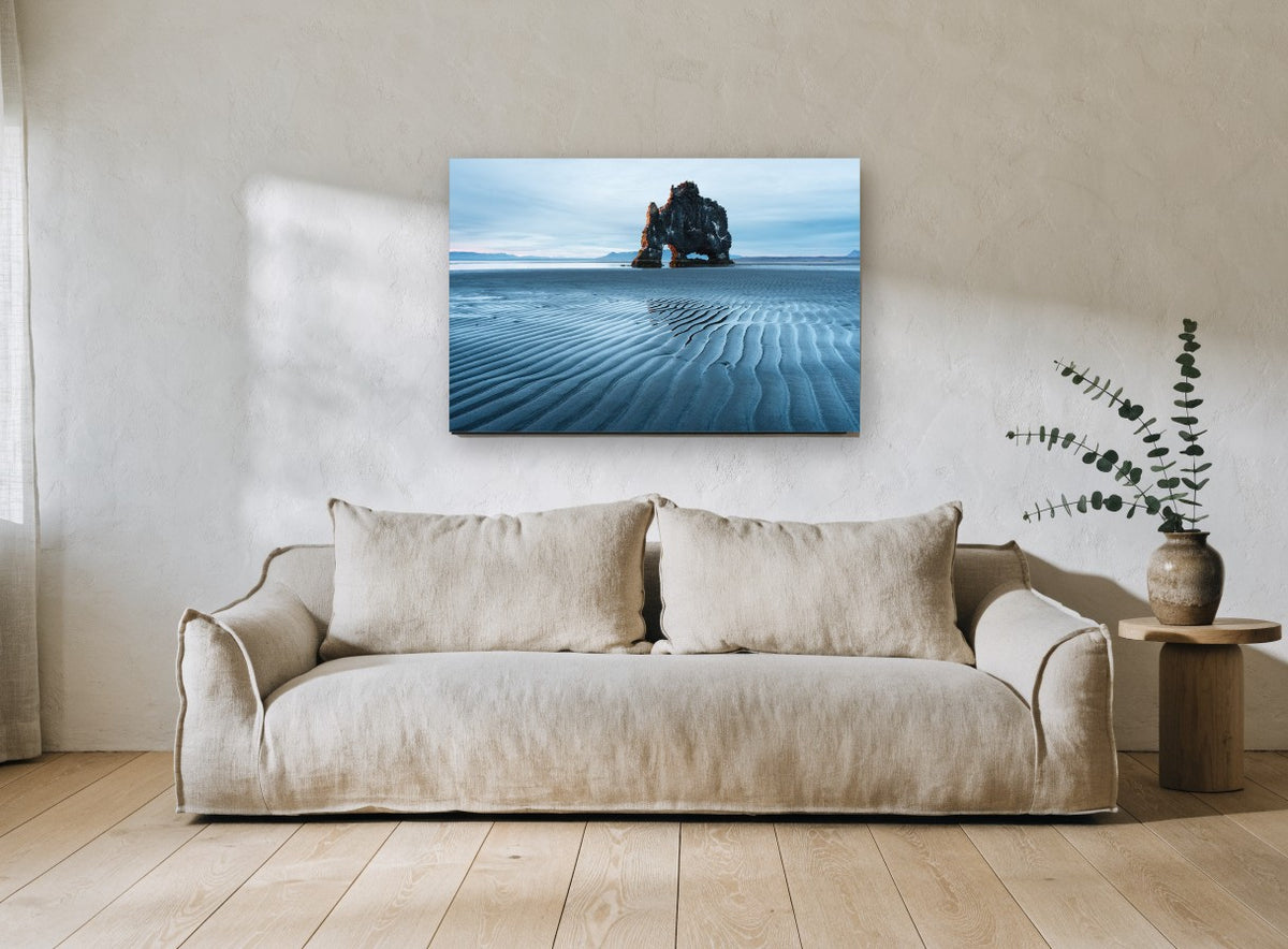 Arch at Low Tide coastal canvas print on the wall of a living room