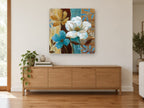 Teal and Ochre Blooms floral canvas print on the wall of a living room above a sideboard