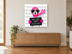 Pink Mugshot Pup animal canvas print on the wall of a living room above a sideboard