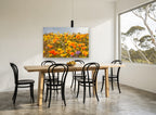 Poppy Hillside Bloom floral canvas print on the wall of a dining room