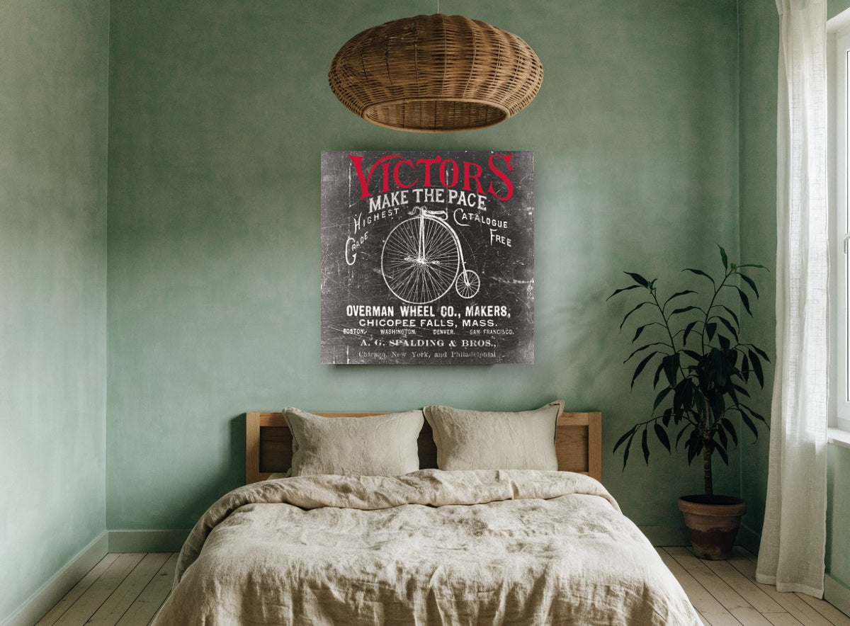 Victors Make the Pace vintage canvas print on the wall of a bedroom