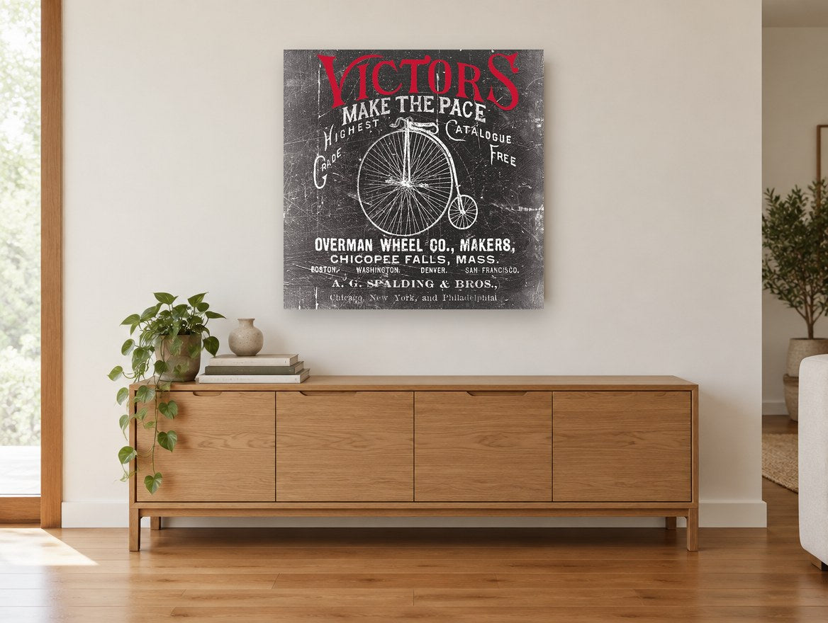 Victors Make the Pace vintage canvas print on the wall of a living room above a sideboard