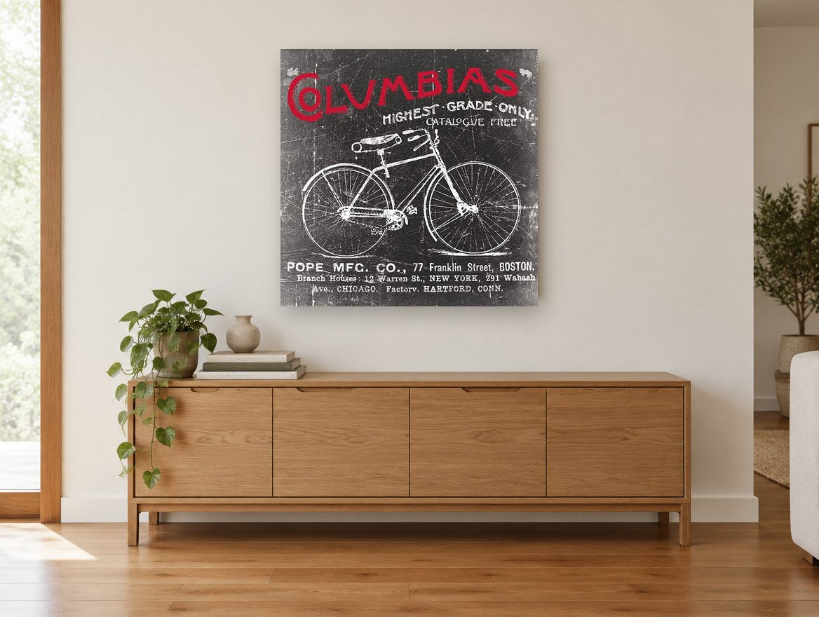 Columbias Bicycle Advertisement vintage canvas print on the wall of a living room above a sideboard