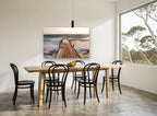 Jetty in the Surge coastal canvas print on the wall of a dining room