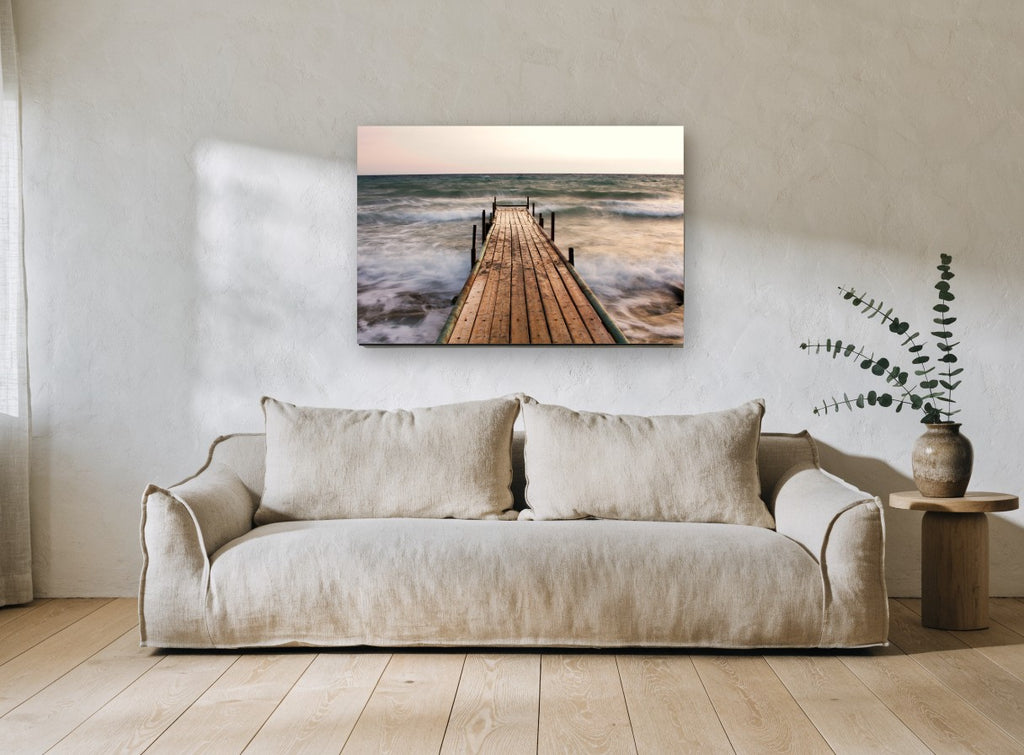 Jetty in the Surge coastal canvas print on the wall of a living room
