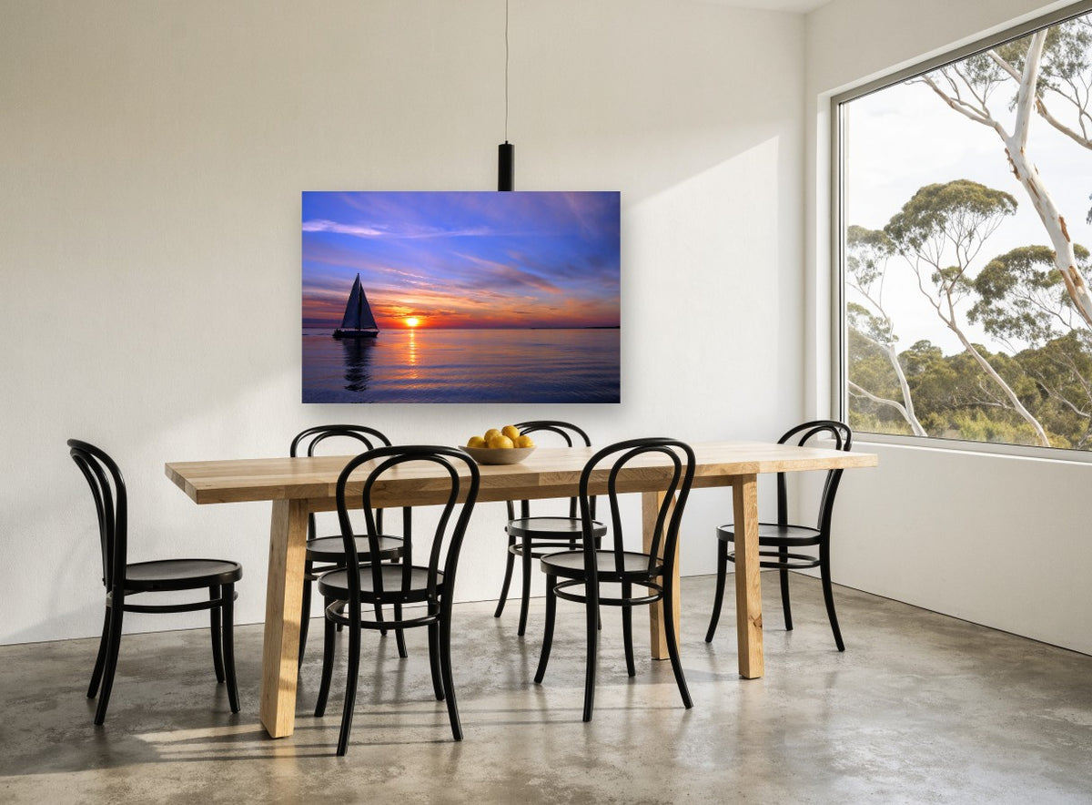 Sailing Into Dusk coastal canvas print on the wall of a dining room