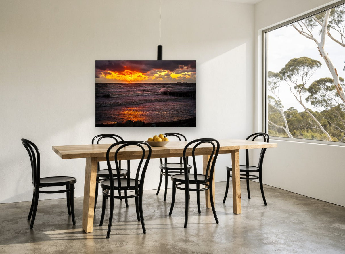 Ember Sky Storm Surf coastal canvas print on the wall of a dining room