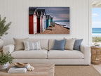 Stormlight Beach Huts coastal canvas print on the wall of a beach house living room