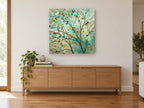 Teal Leaf Canopy landscape canvas print on the wall of a living room above a sideboard