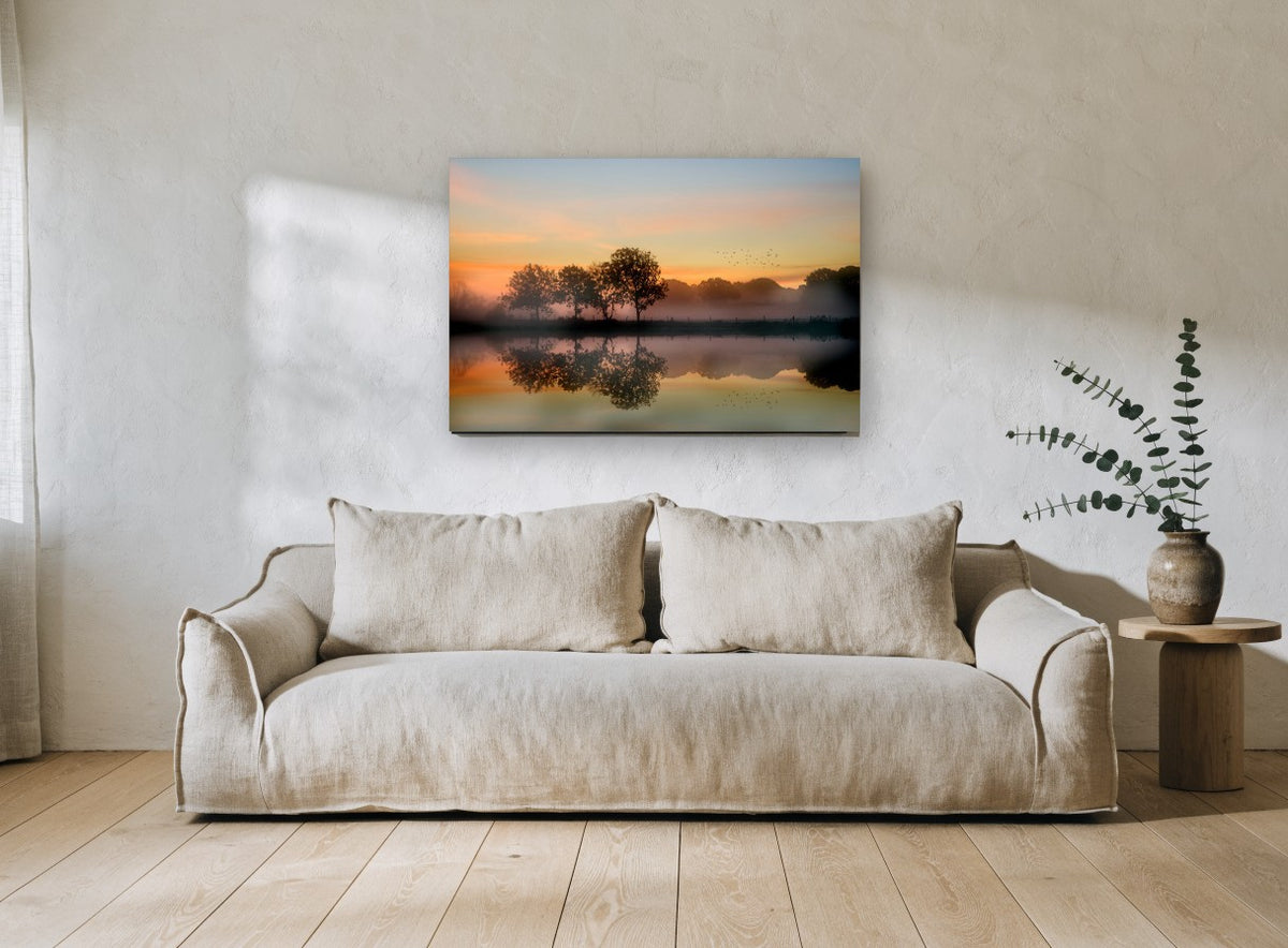 Amber Dawn Reflections landscape canvas print on the wall of a living room