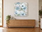 Soft Blue Anemones floral canvas print on the wall of a living room above a sideboard