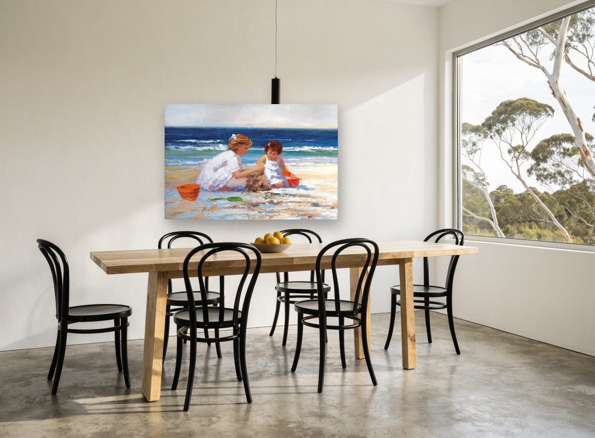 Sandcastle Sisters coastal canvas print on the wall of a dining room