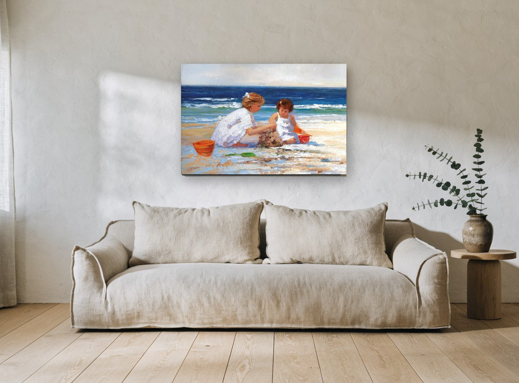 Sandcastle Sisters coastal canvas print on the wall of a living room