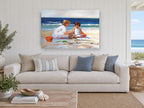 Sandcastle Sisters coastal canvas print on the wall of a beach house living room