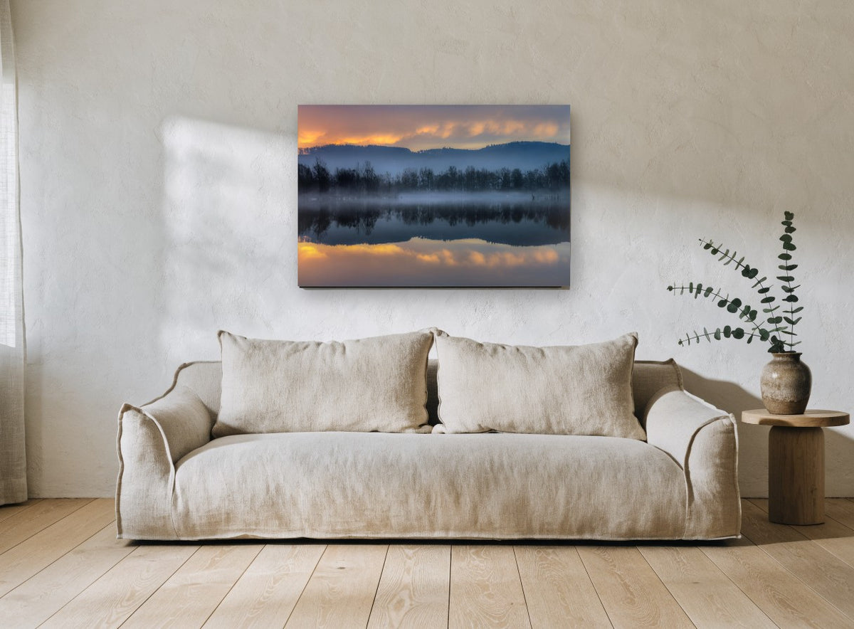Blue Mist Lakeshore Mirror landscape canvas print on the wall of a living room