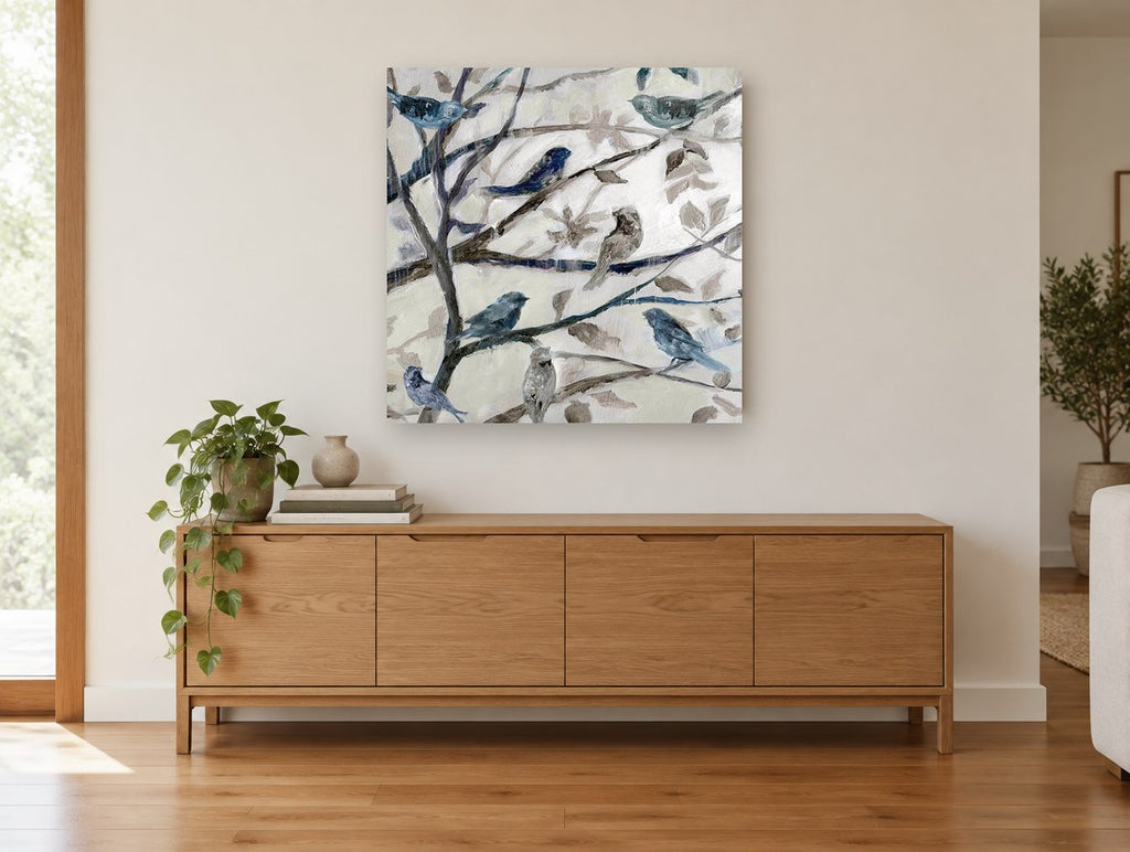 Songbirds in Bare Branches floral canvas print on the wall of a living room above a sideboard