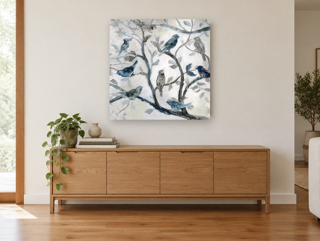 Blue Birds in Branches floral canvas print on the wall of a living room above a sideboard