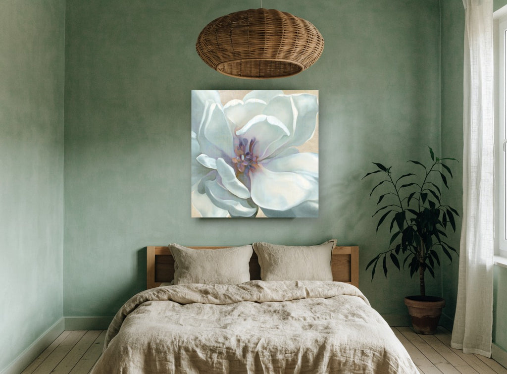 Pale Magnolia Bloom floral canvas print on the wall of a bedroom