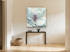 Pale Magnolia Bloom floral canvas print on the wall of a hallway