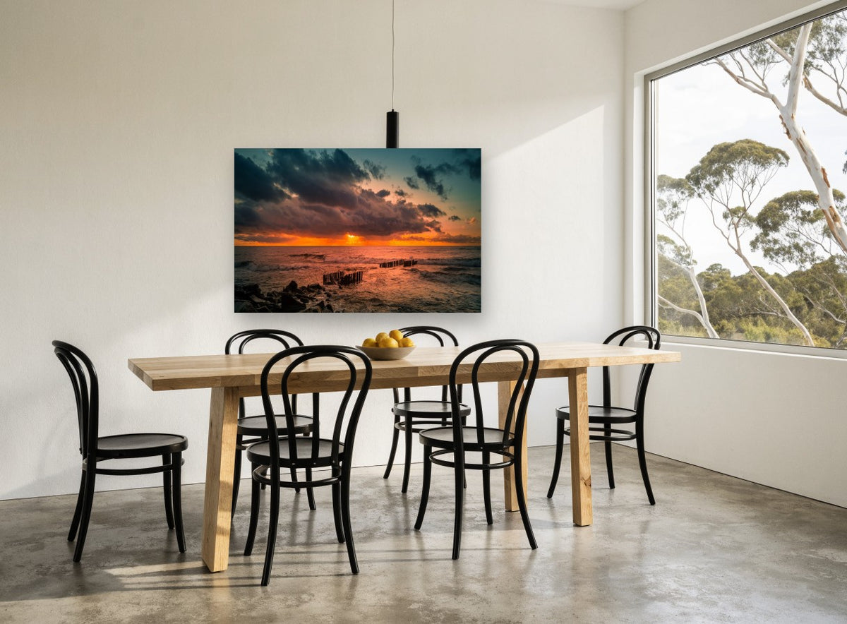 Ember Sky Breakwater coastal canvas print on the wall of a dining room