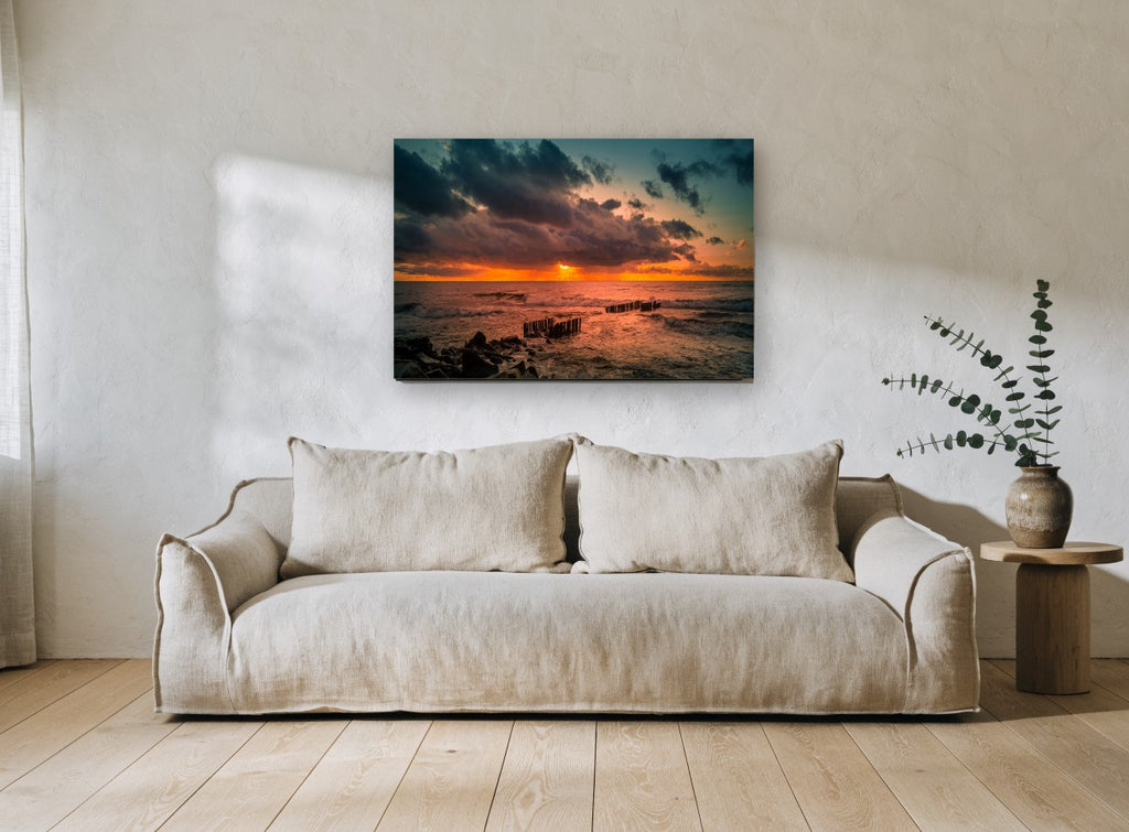 Ember Sky Breakwater coastal canvas print on the wall of a living room