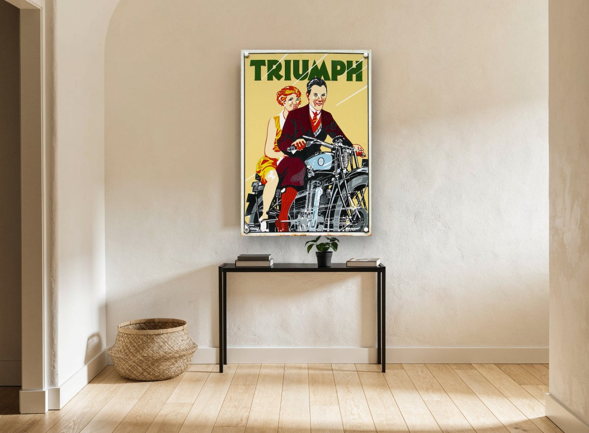 Triumph Couple Ride Out vintage canvas print on the wall of a hallway