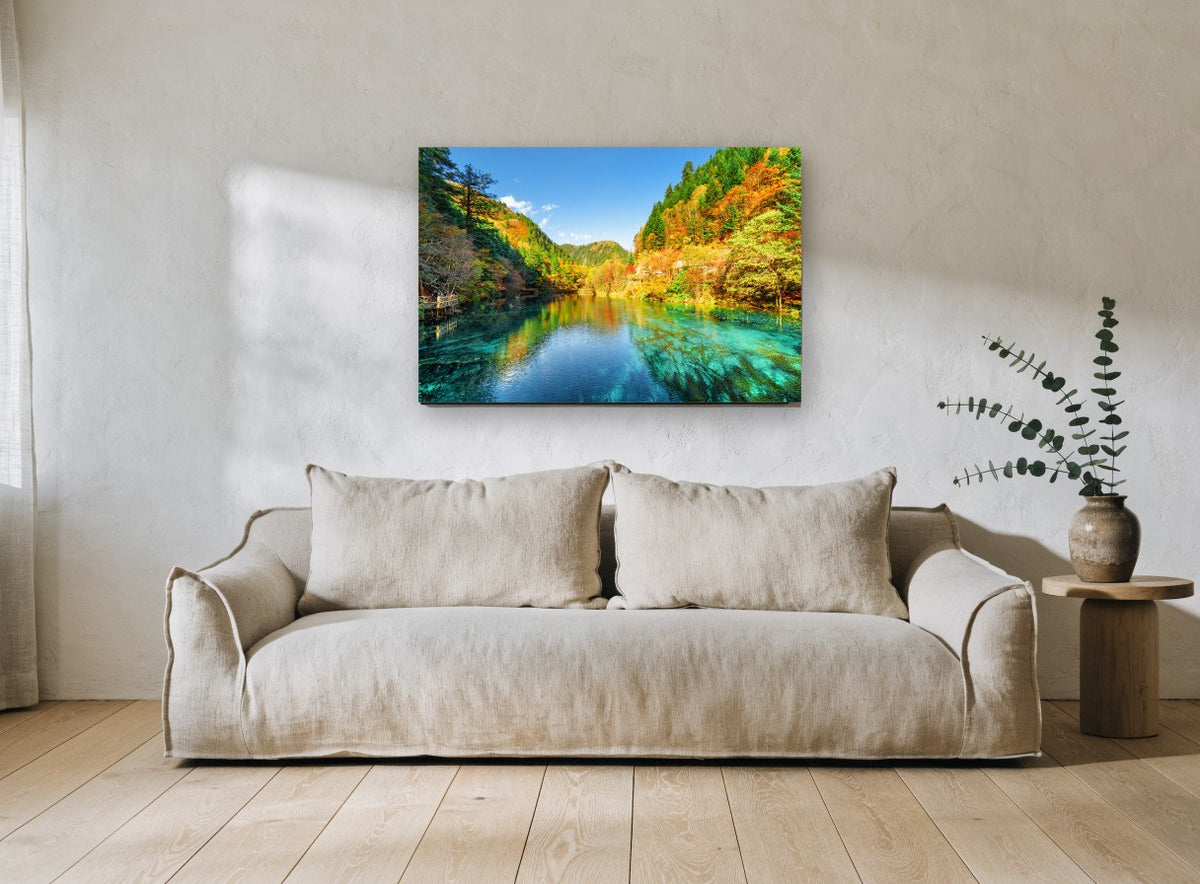 Turquoise Autumn Lake landscape canvas print on the wall of a living room